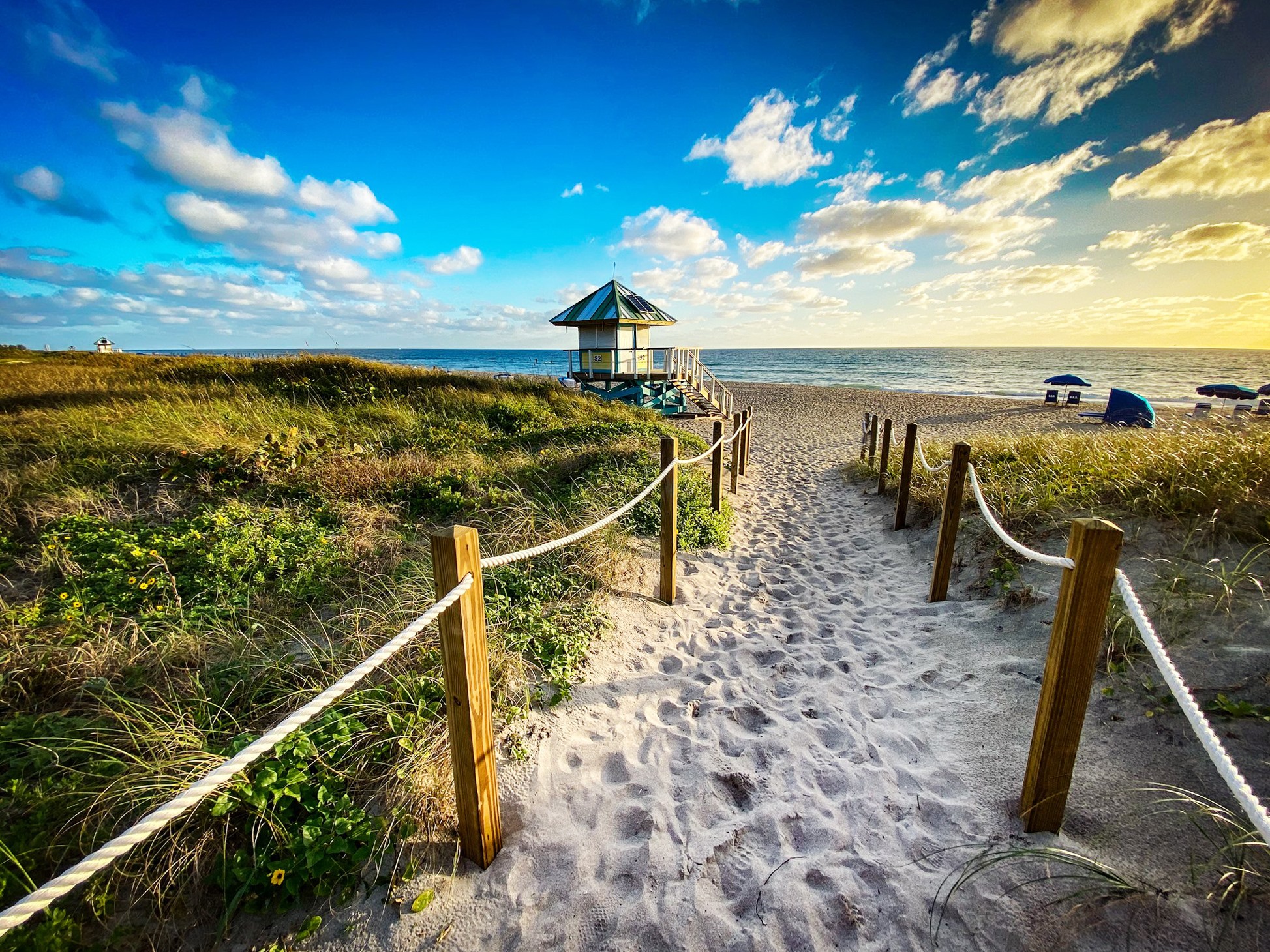 Beach path, lifeguard tower, and Atlantic sunrise in Delray Beach